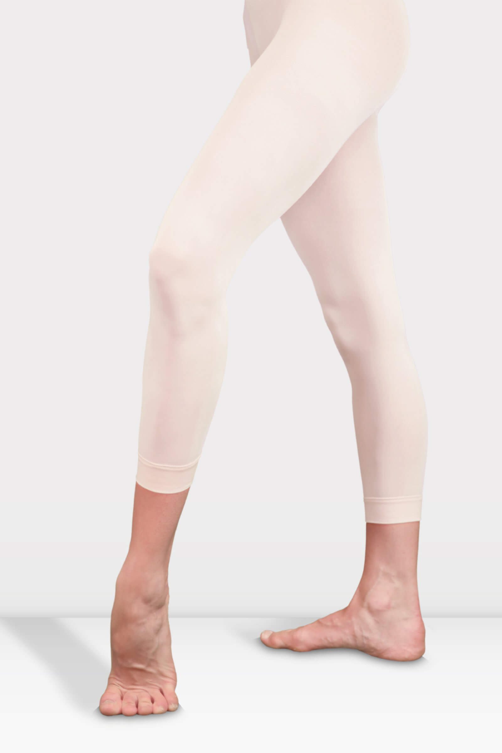 Harmony Pink Ballet Footless Tights Front View Розов балетен клин без стъпала Harmony на чист фон, показващ еластичния колан на талията и маншетите на глезените