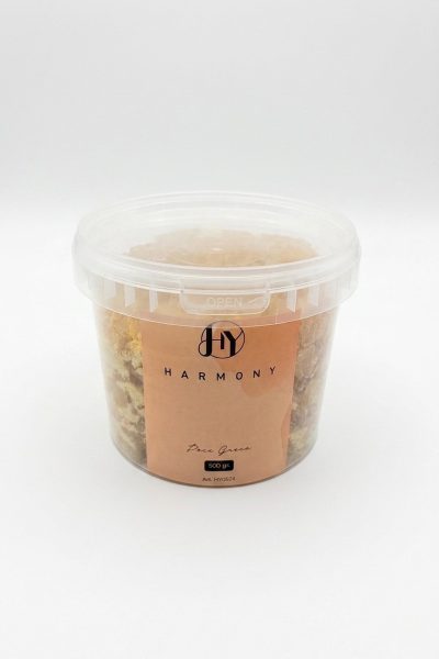 Кутия, показваща детайли от естествените кехлибарени кристали на колофон Harmony.
